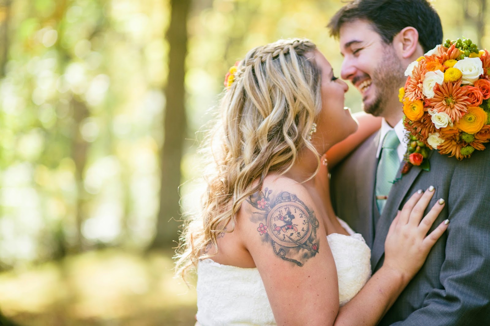 LaurenandRyanLaughing.BridewithMickeyMousetattoo.AlisaTonggCelebrant.IsabelMarchPhotography