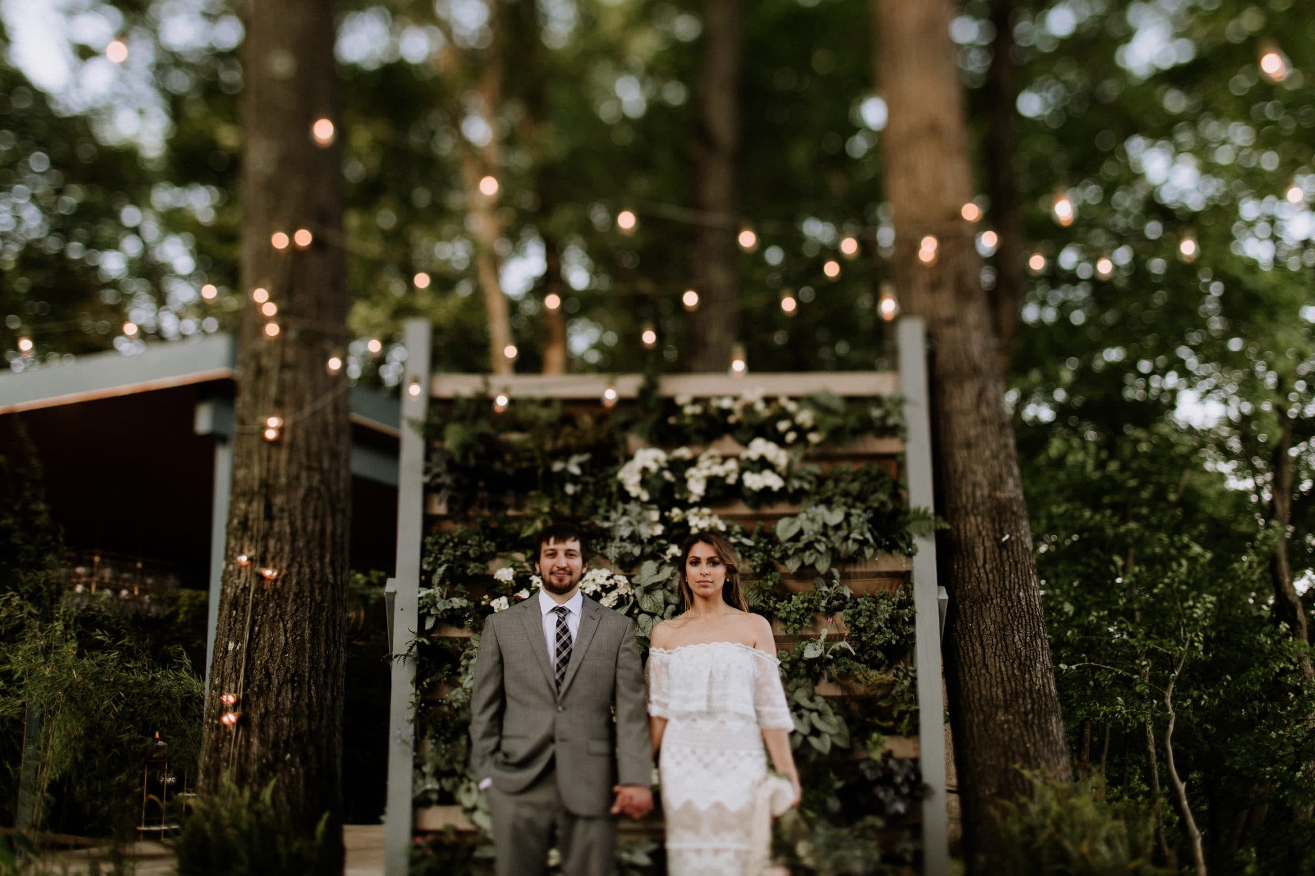 couple holding hands at wedding