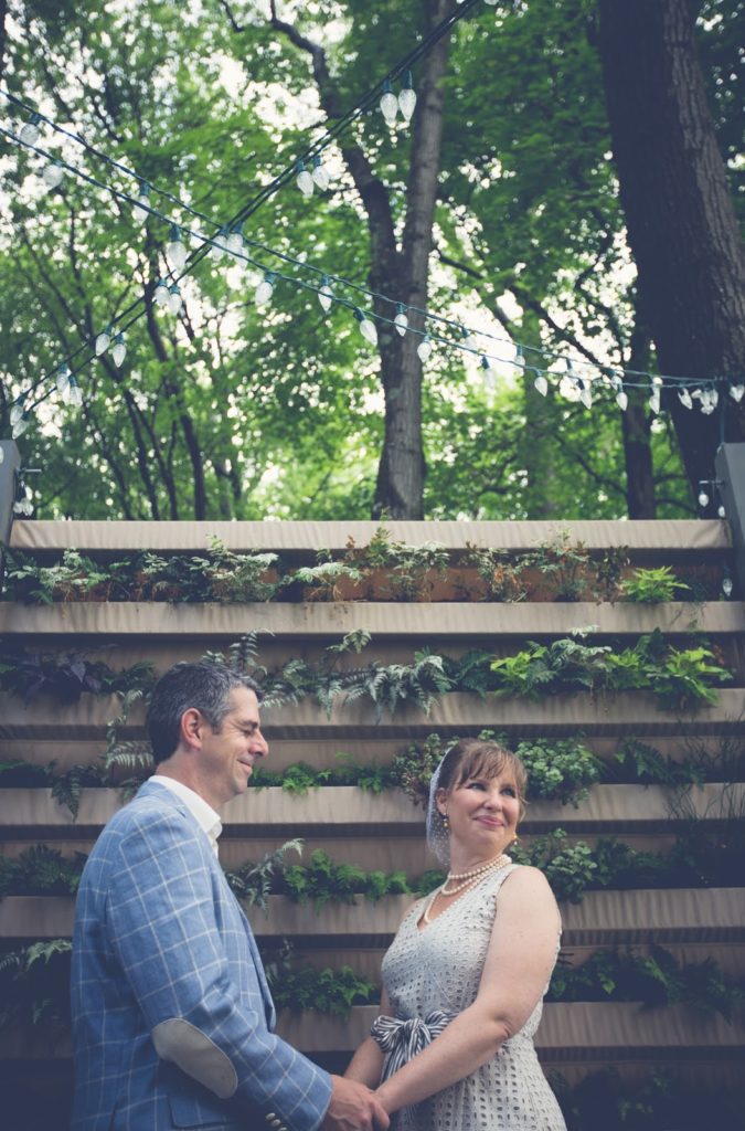 Heather and Nathan hold hands Alisa Tongg Celebrant Family Vow Renewal at The Living Wall at Promise Ridge Jeremie Barlow Photography