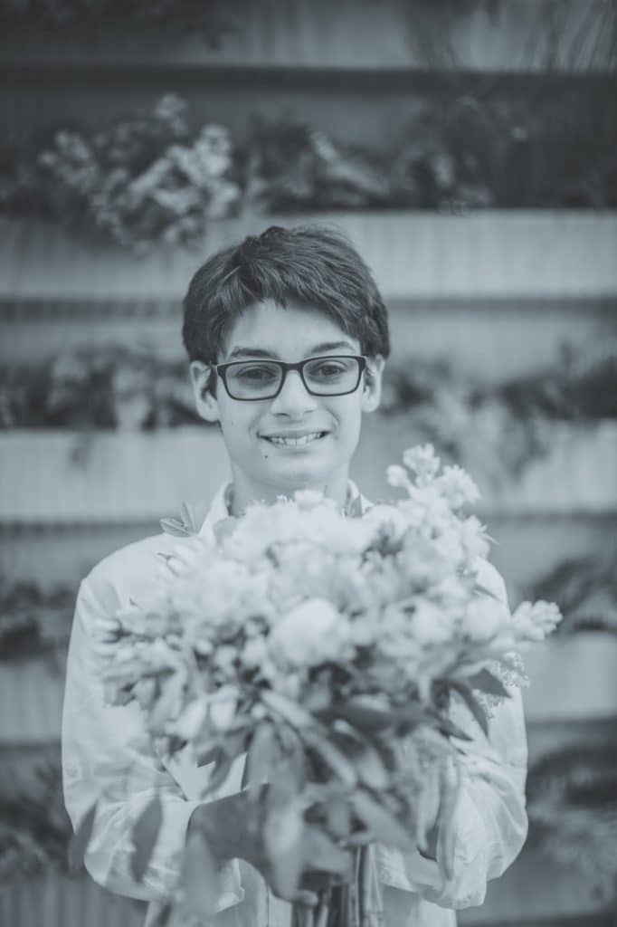 Mika with bouquet Alisa Tongg Celebrant Family Vow Renewal at The Living Wall at Promise Ridge Jeremie Barlow Photography