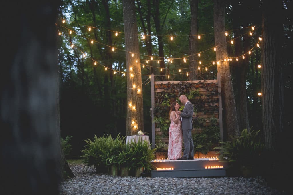 candle lit first dance intimate Blue Hour Elopement at The Living wall at Promise Ridge Rob Yaskovic Photography