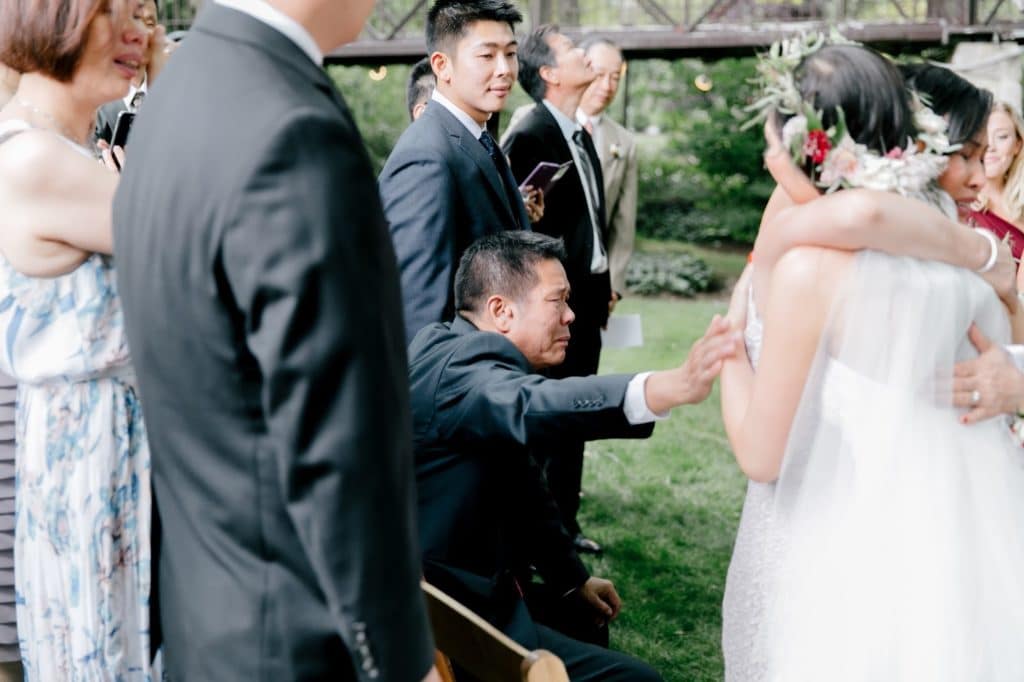 father reaches for bride at hand off alisa tongg celebrant emily wren photography