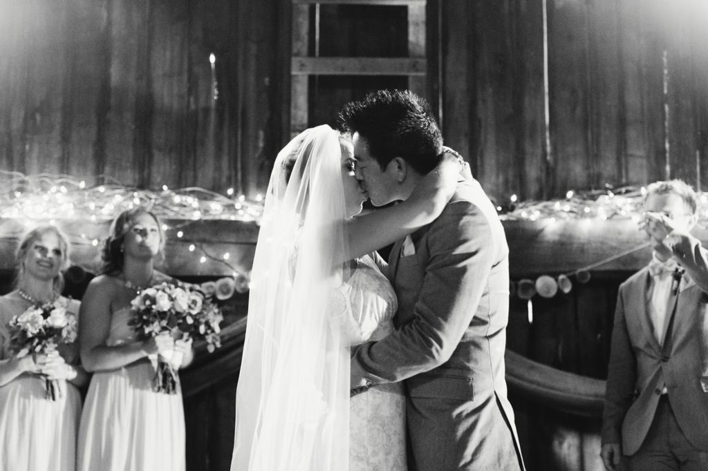 first kiss black and white alisa tongg celebrant with love and embers photography