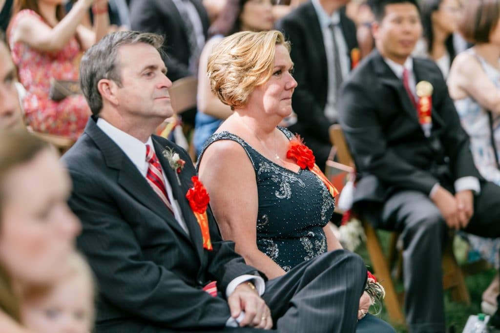 grooms parents adorned with red garlands for chinese tea ceremony alisa tongg celebrant emily wren photography