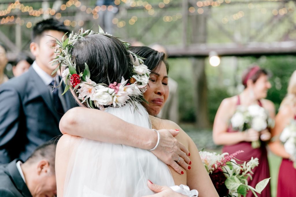 mother embraces bride right before i dos alisa tongg celebrant emily wren photography