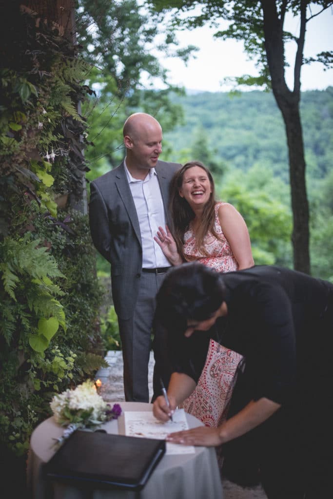 signing marriage certificate Blue Hour Elopement at The Living wall at Promise Ridge Rob Yaskovic Photography