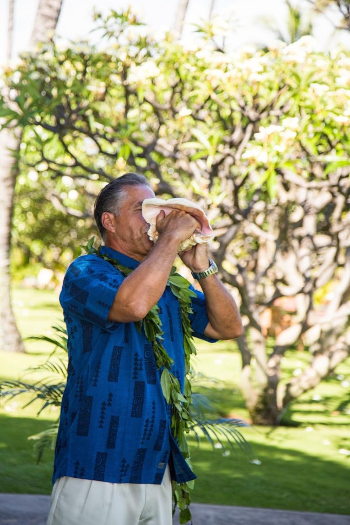 uncle michael blowing the conch alisa tongg celebrant chelsea heller photography