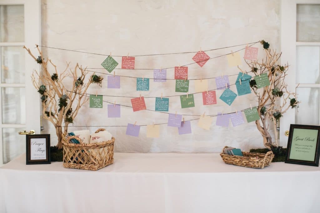 wedding guestbook inspired by prayer flags alisa tongg celebrant the manor house at prophecy creek emily wren photography